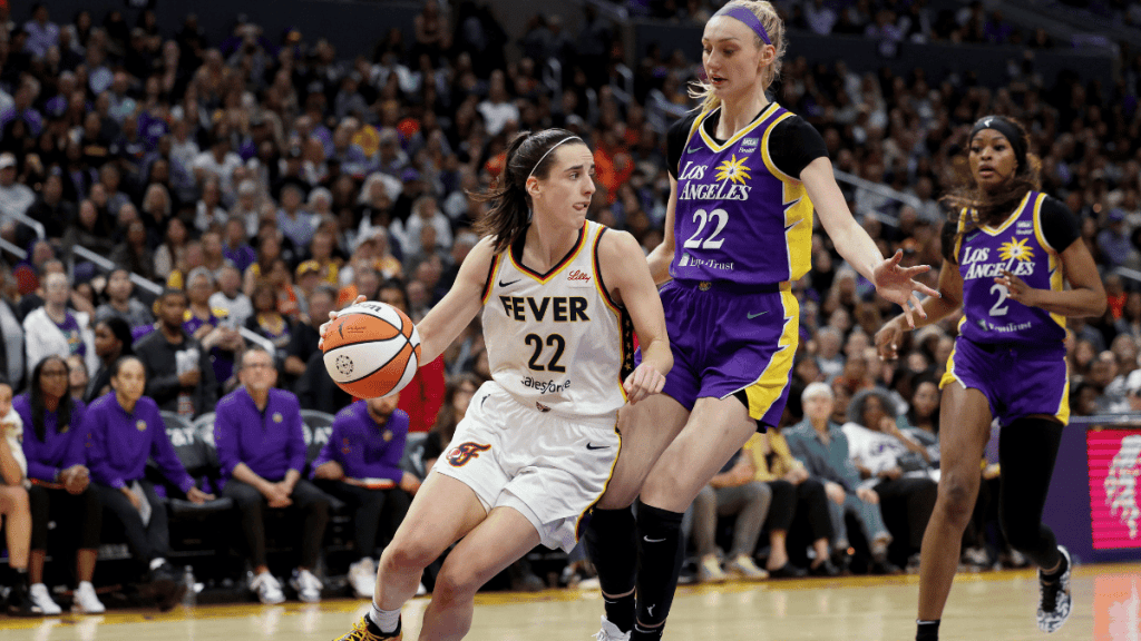 Caitlin Clark #22 of the Indiana Fever drives to the basket against Cameron Brink #22 of the Los Angeles Sparks 