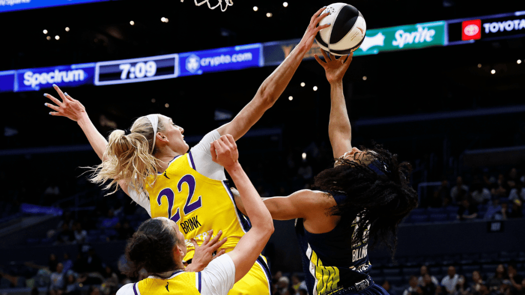 Cameron Brink #22 of the Los Angeles Sparks blocks the shot against Monique Billings #25 of the Dallas Wings