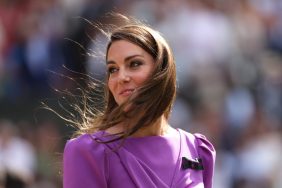 Kate Middleton at Wimbledon wearing a purple dress, her hair flowing in the wind.