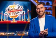 Travis Kelce stands in Are You Smarter Than a Celebrity?