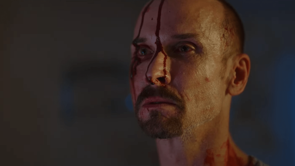 The Pale Face Killer Terrifies Victims in the He Never Left Trailer