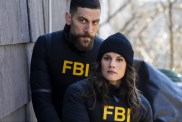 A man and woman with FBI vests stand next to each other.