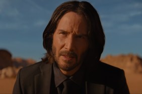 Keanu Reeves sits in the desert in John Wick: Chapter: 4.