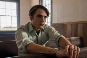 Robert Pattinson sits in a pew in The Devil All The Time.