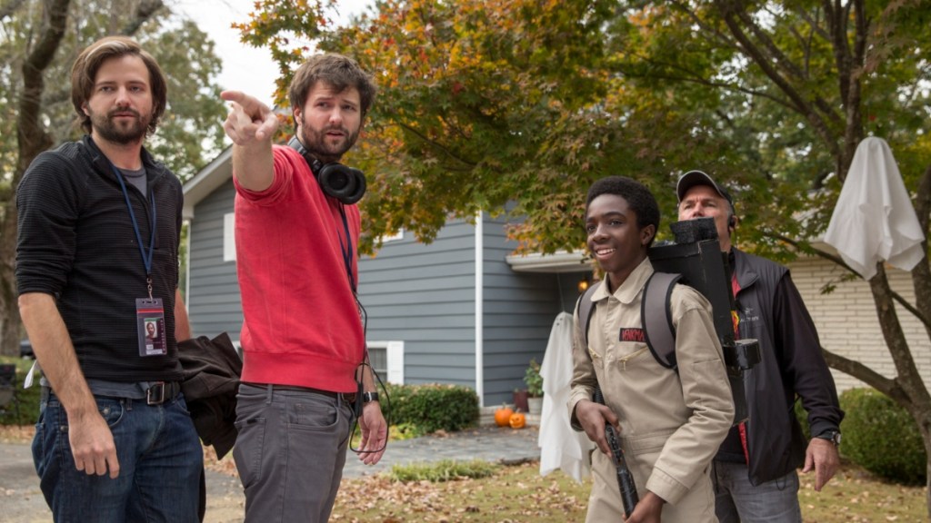 The Duffer Brothers stand on the set of Stranger Things.