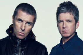 Liam and Noel Gallagher pose for a photo.