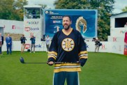 Adam Sandler holds a golf club in Happy Gilmore.