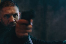 Tom Hardy points a gun in Havoc.