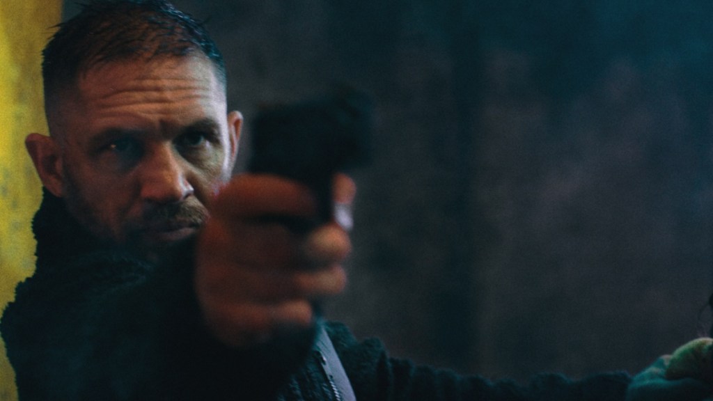 Tom Hardy points a gun in Havoc.